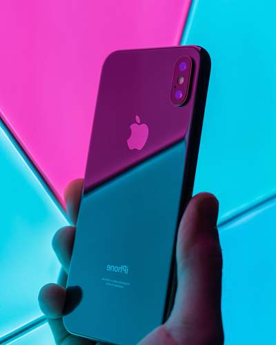 cell phone person holding post-2017 black iPhone electronics